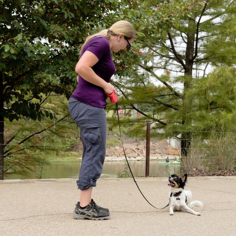 Rebecca Owner of Trusty Tails Dog Training Tulsa Getting dog kissesh